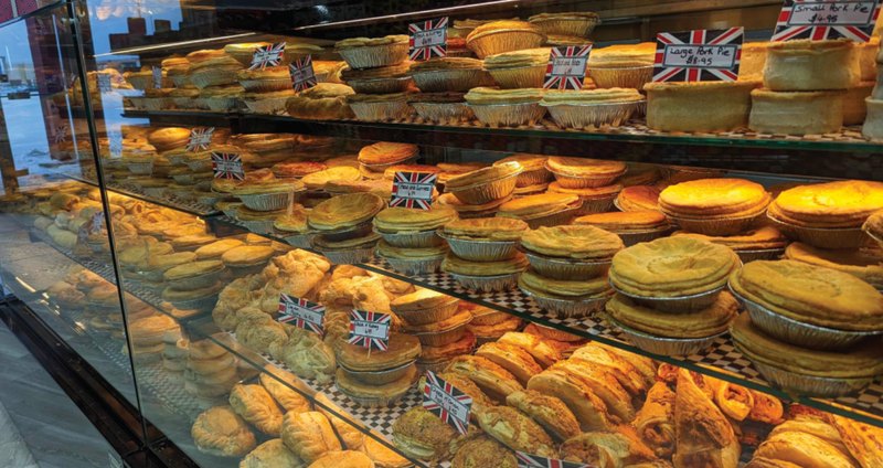 Fresh pies and pastries with Union Jack flags in the Halifax bakery counter