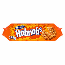 McVitie’s Original Hobnobs 255g, shown straight on in an orange wrapper with the blue McVitie’s crest and two oaty biscuits, one broken.