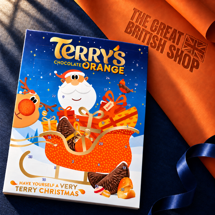 Terry's Chocolate Orange 106g Advent Calendar on navy bookcloth beside orange wrapping paper embossed with The Great British Shop logo